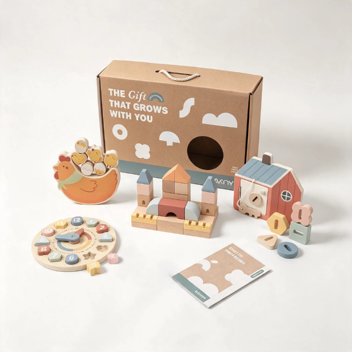 Wooden educational toy set with chicken, clock, castle blocks, barn house, and shape blocks, box labeled 'The Gift That Grows With You'
