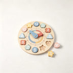 Wooden educational clock toy with colorful numbers and shapes, movable hands.