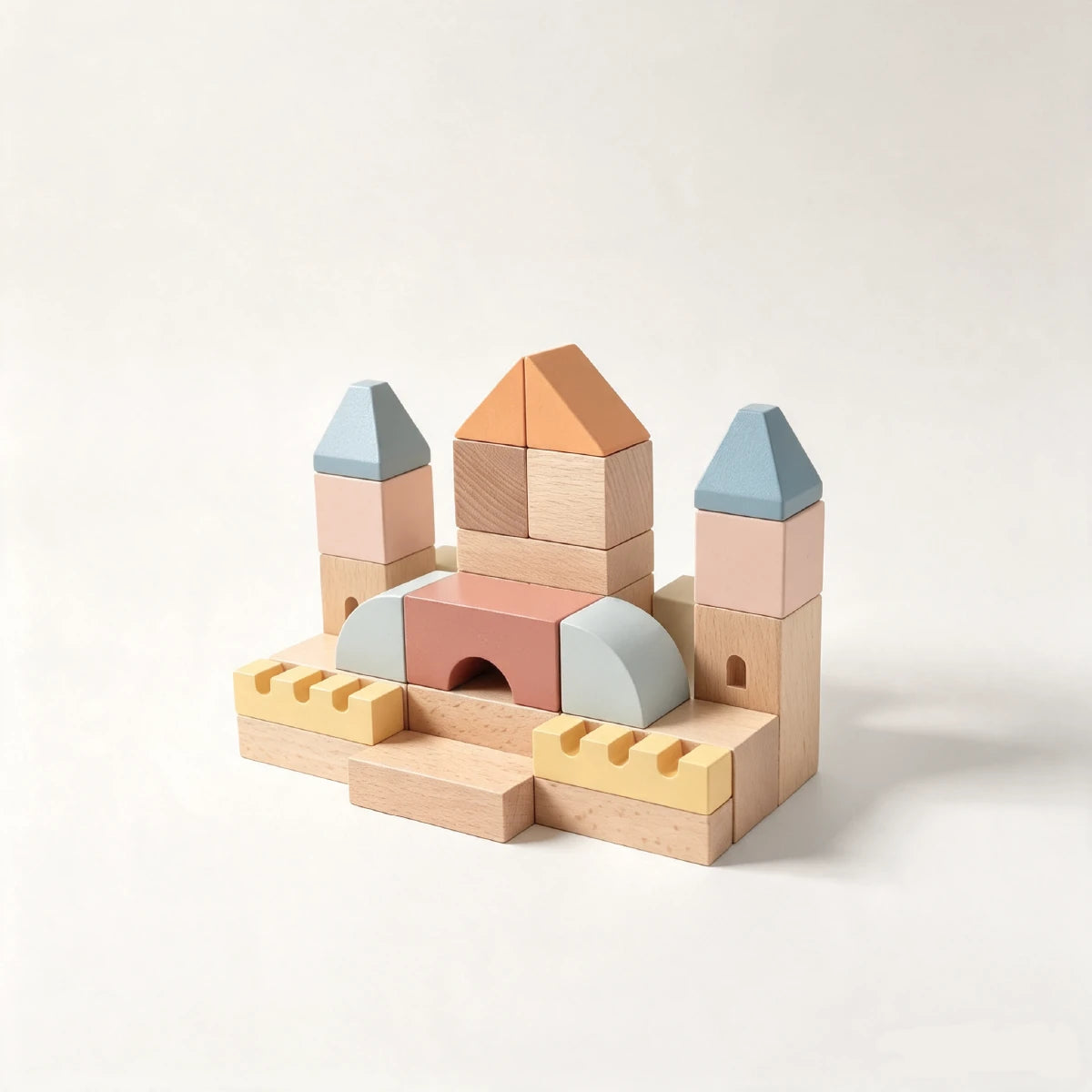 Wooden castle toy with blue and orange roofs.