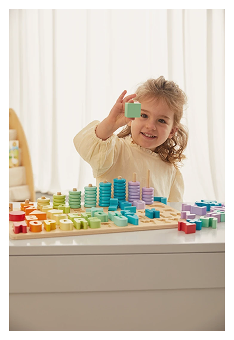 Child with Freniland wooden toy showing colorful letters and rings.