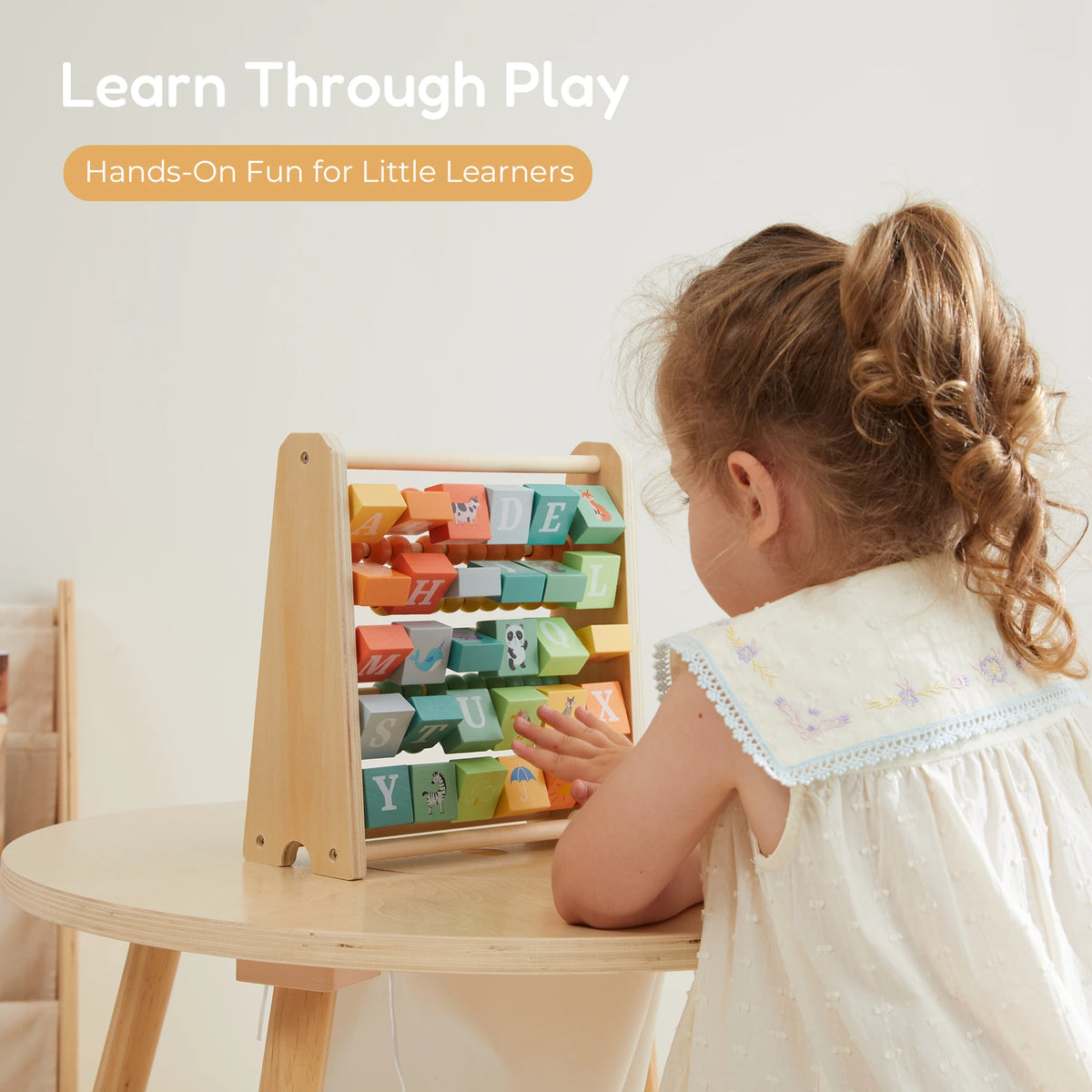 2-in-1 Abacus Stand & Alphabet Abacus - girl playing learn through play