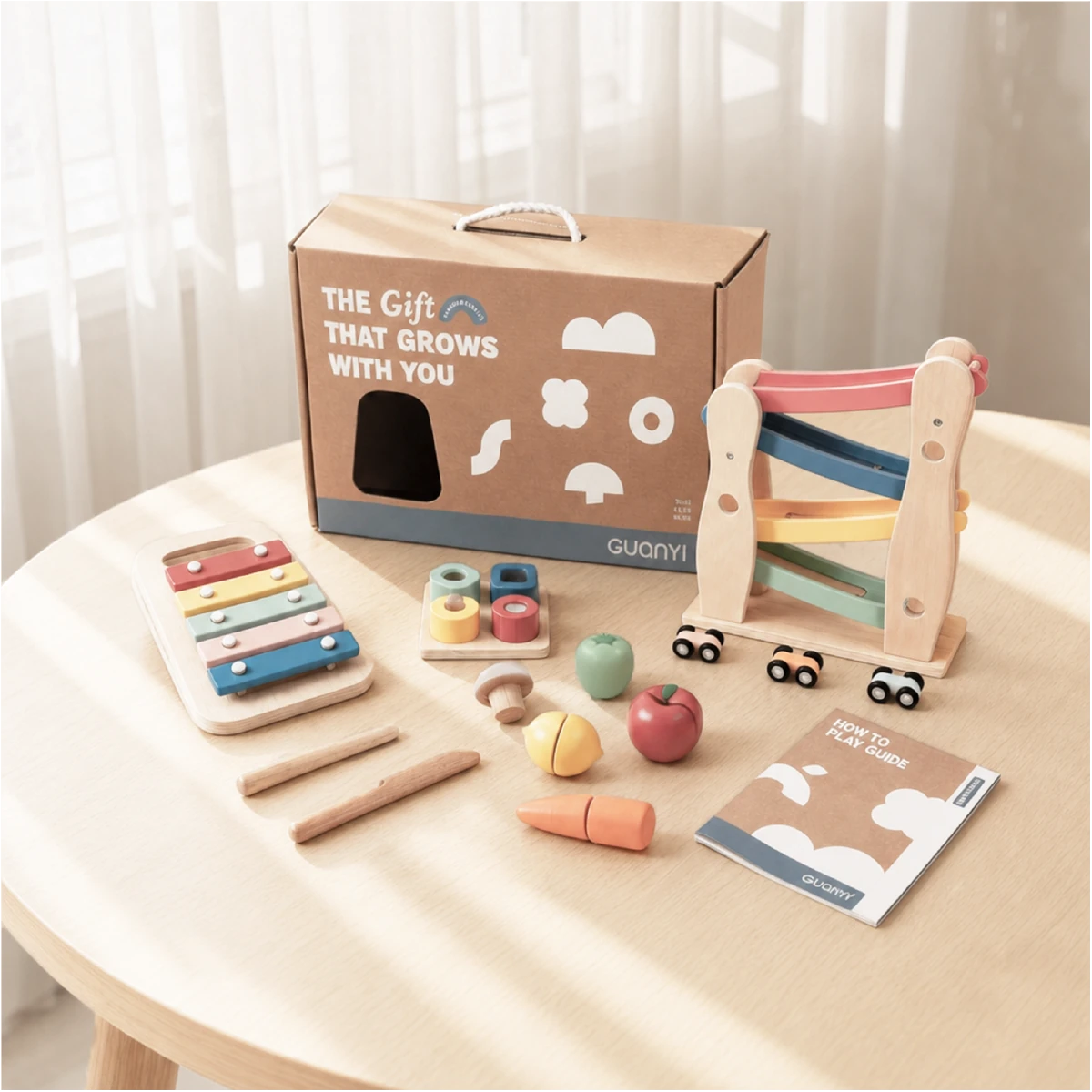 The Player Growing Play Box - montessori months gift set lifestyle wooden table