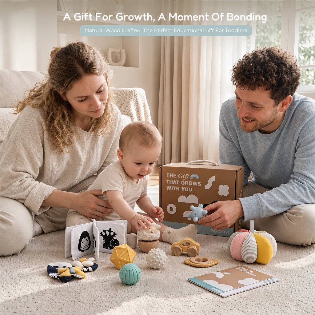 The Smiler Growing Play Box - mother, father and baby playing with the full set on a rug