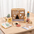 The Discoverer Growing Play Box - full set arranged on a wooden table with the gift box