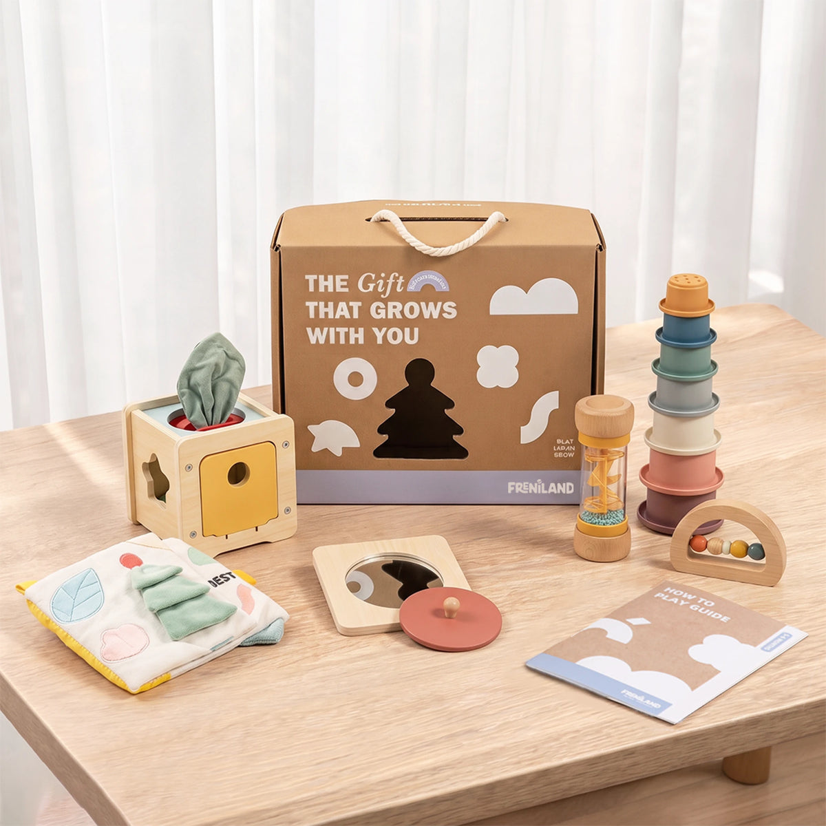 The Discoverer Growing Play Box - full set arranged on a wooden table with the gift box