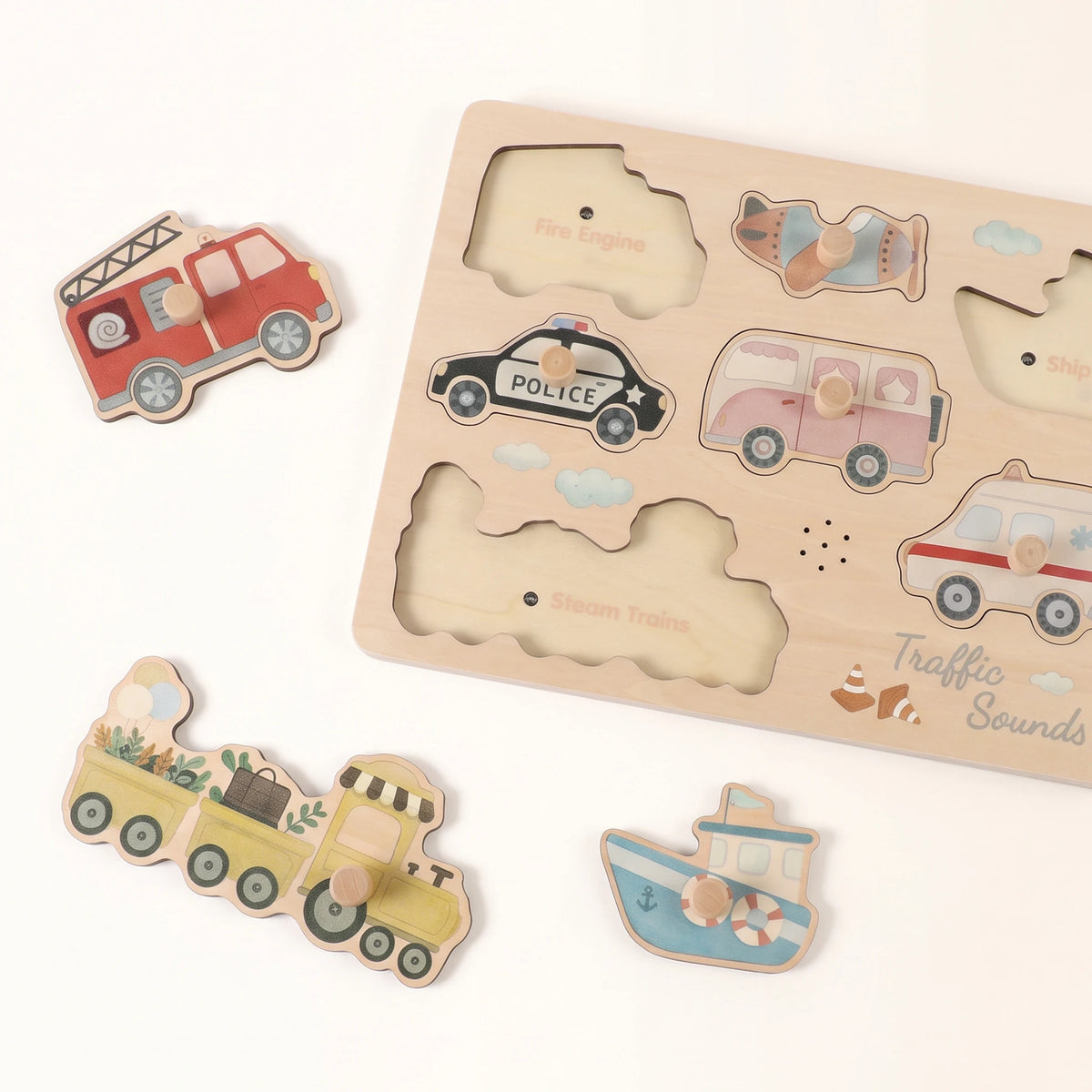 Freniland Wooden Sound Puzzle 2-Pack - Traffic Sounds board with seven vehicle pieces laid out