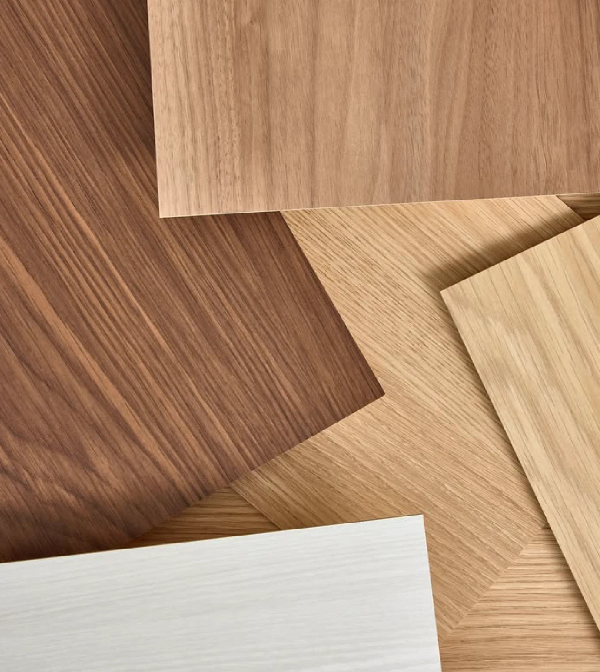 Various wooden panels with different colors and grain patterns for educational toys.