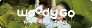 Child with wooden educational toy (woddygo brand) in nature