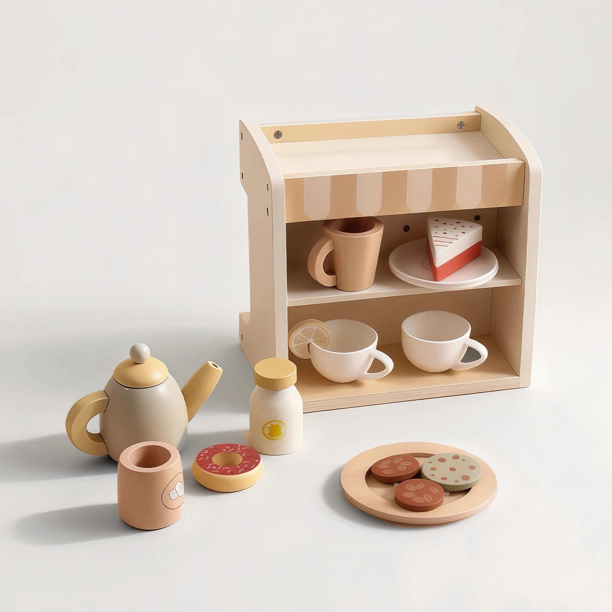 Wooden toy café playset with teapot, mugs, donut, and cookies.