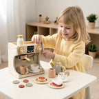 Child plays with wooden coffee maker and tea set toy set.