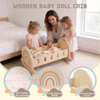 Little girl playing with a wooden rainbow toy doll cradle
