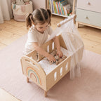 Wooden doll bed girl tucking teddies bedroom lifestyle