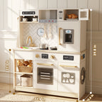 White wooden children's play kitchen with oven, microwave, sink, and storage.